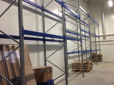 Delivery and installation of new warehouse equipment in the Sonel warehouse. Console shelving system for warehouse. Warehouse shelves and equipment VVN.LV 4
