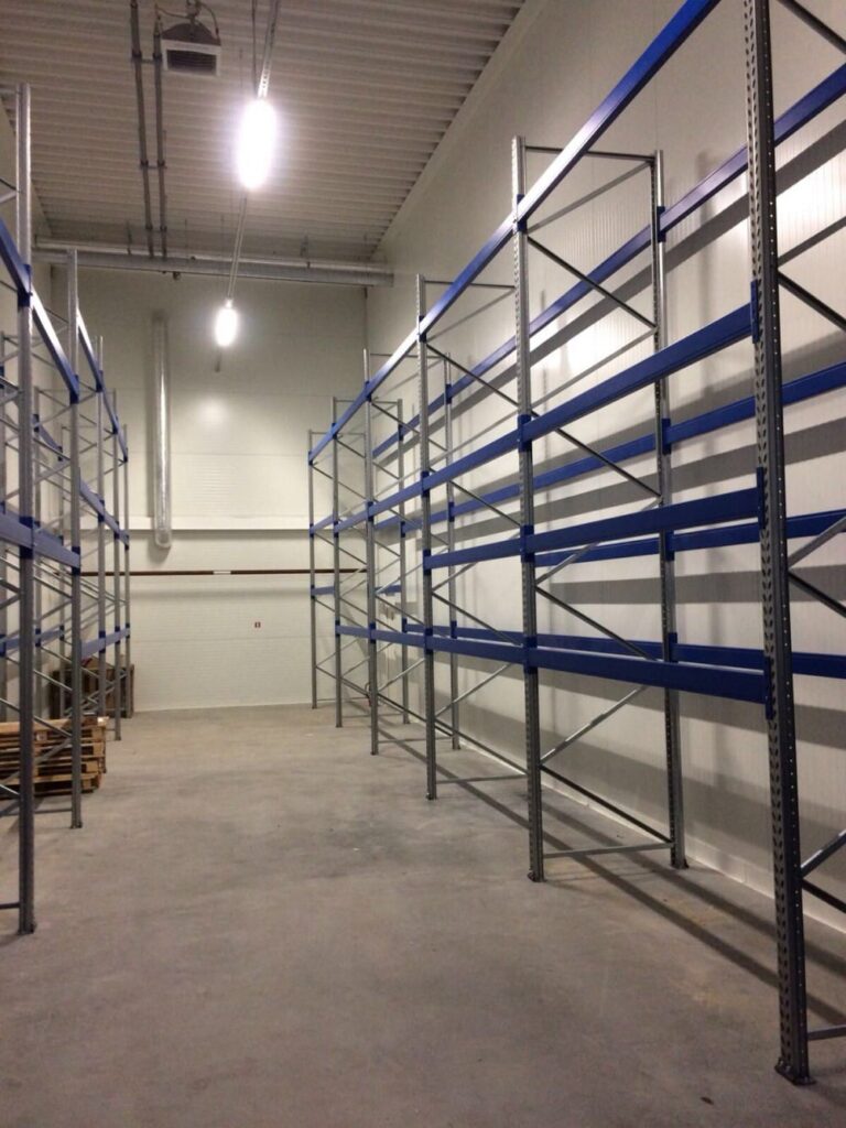 Delivery and installation of new warehouse equipment in the Sonel warehouse. Console shelving system for warehouse. Warehouse shelves and equipment VVN.LV